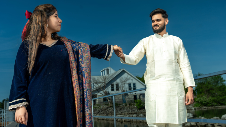 A couple posing at a picturesque outdoor location for their prewedding shoot